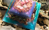 Orgonite crystal pyramid made with rose quartz, larimar, ajoite, pink tourmaline, chrysocolla, and copper